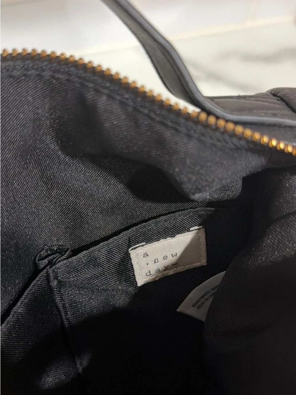 a new day Black Pebbled Faux Leather Backpack with Gold Accents